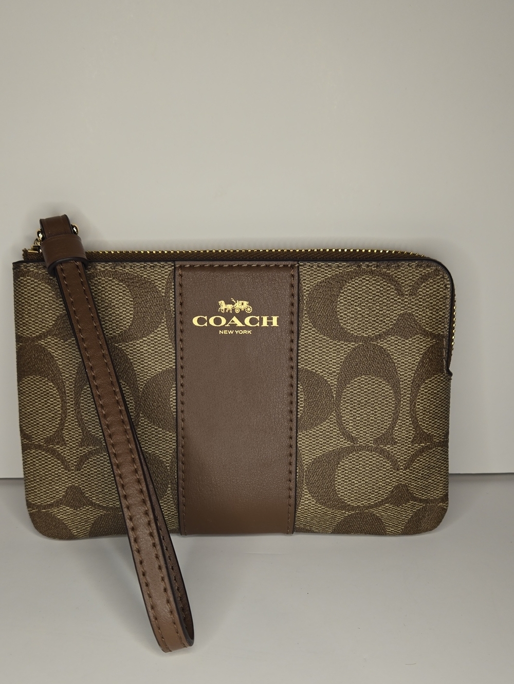 Coach Corner Zip Wristlet In Signature Canvas Khaki Saddle C2198